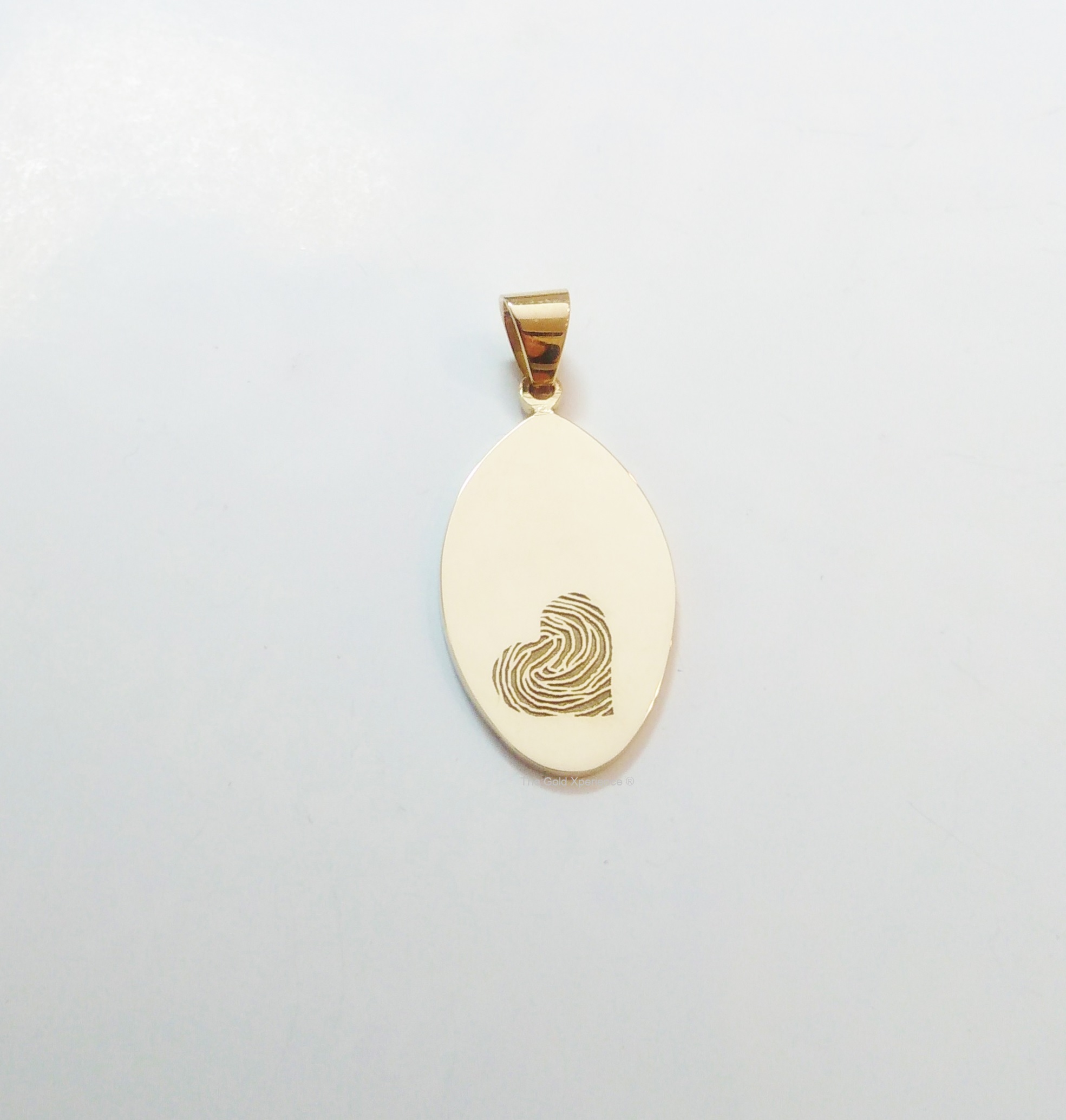 Gold pendant fingerprint laser