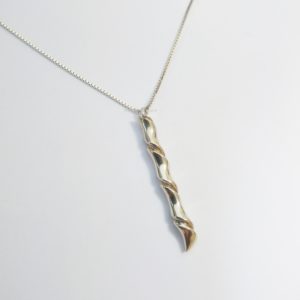 Silver pendant with gold