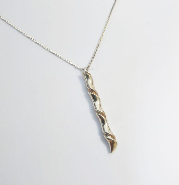 Silver pendant with gold