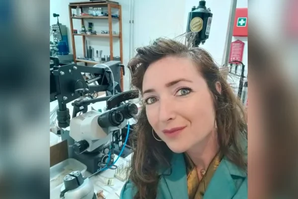 Goldsmith diamond setter behind microscope